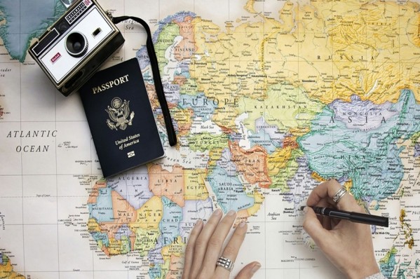 Map with passport and camera