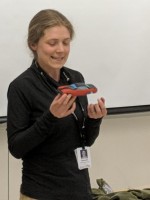 Student holding a 3D printed model car