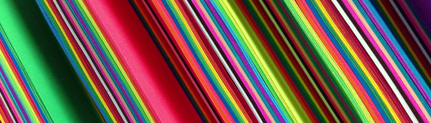 a close up photo of brightly colored paper