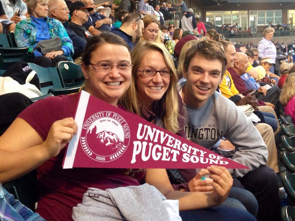 Stadium audience holding University flag