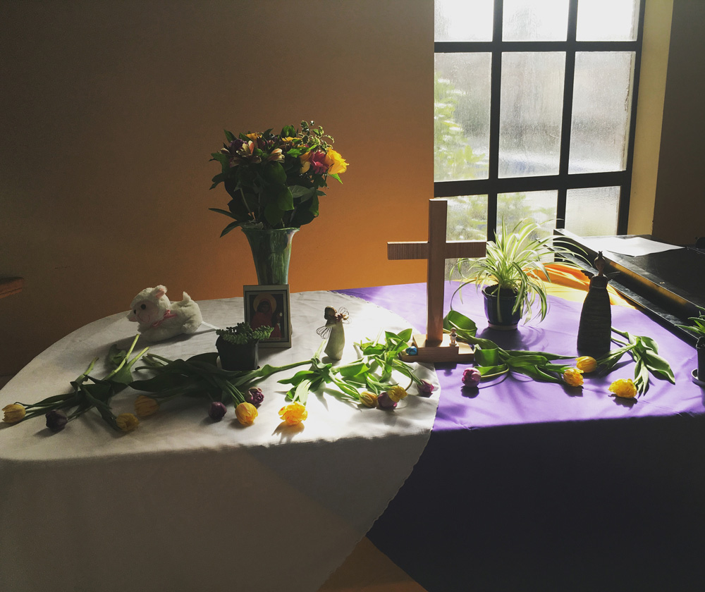 Table setting with flowers and cross