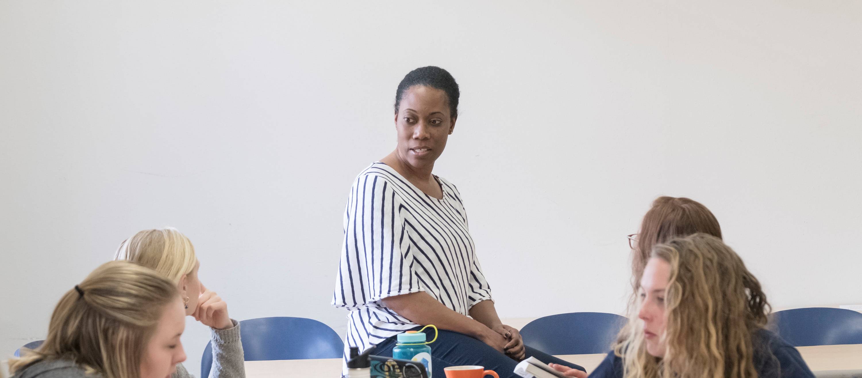 Professor Renee Simms interacts with students in class.