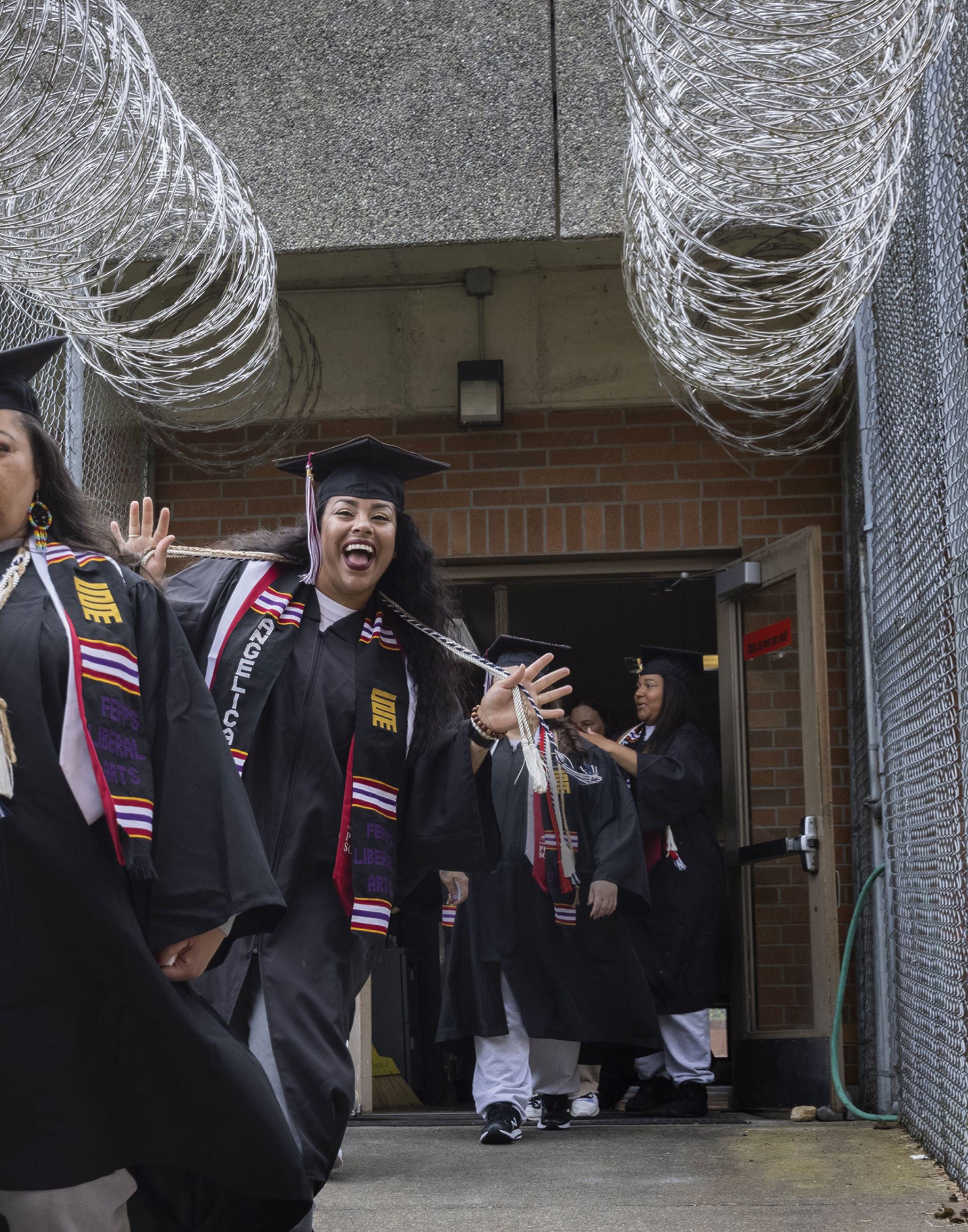 A smiling grad at the FEPPS Commencement ceremony in June 2024.