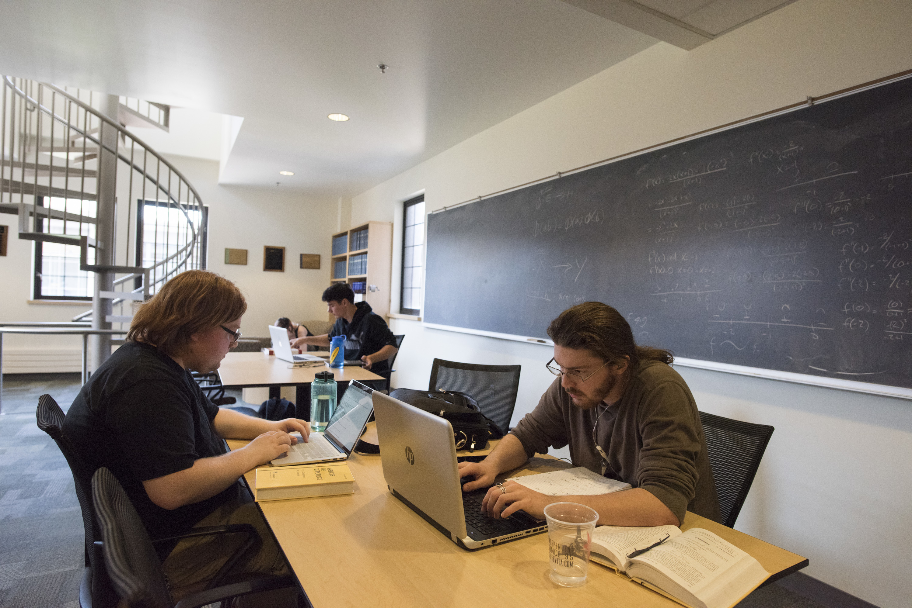 Students at work in the mathematics lounge in Thompson Hall.