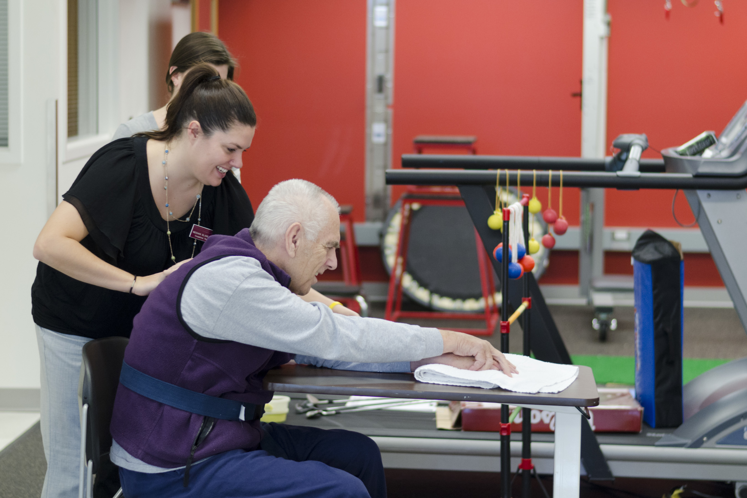 A student works with a clinic patient.