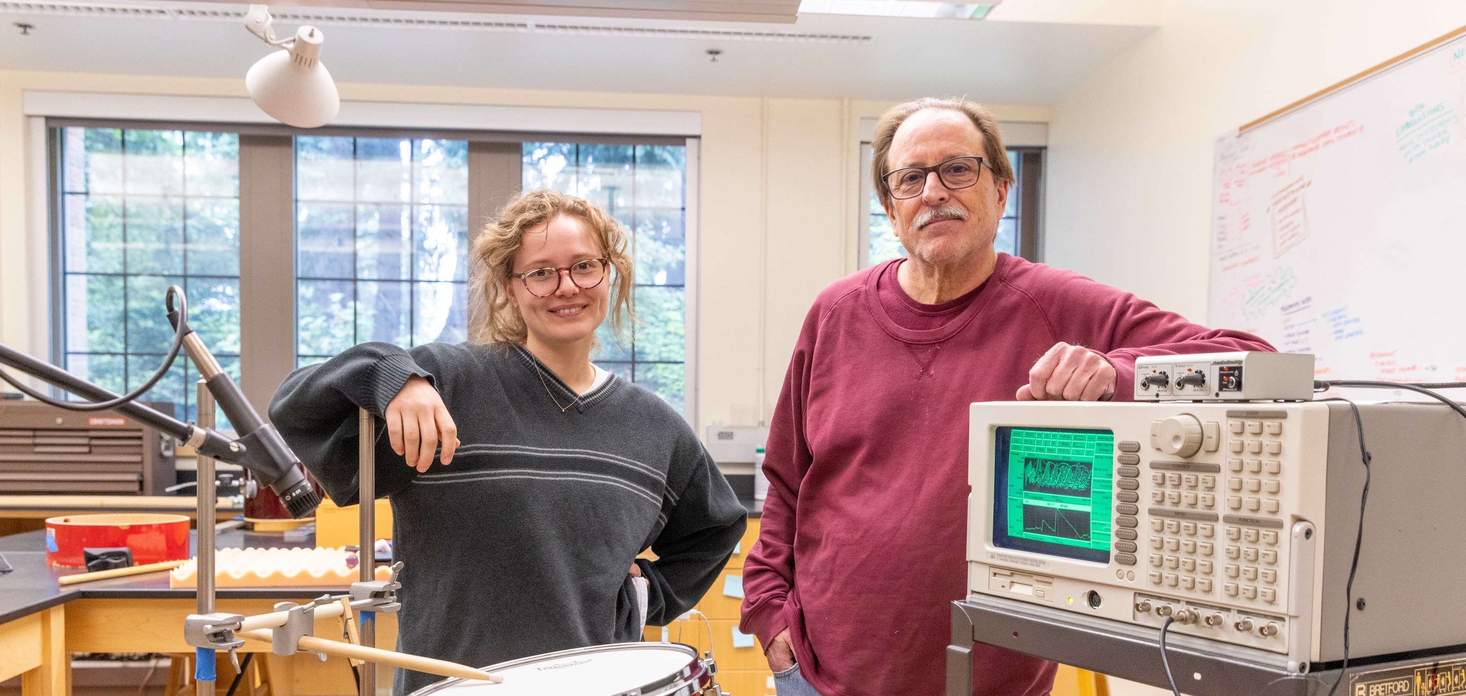 Professor and student with the equipment they used for a summer research project.