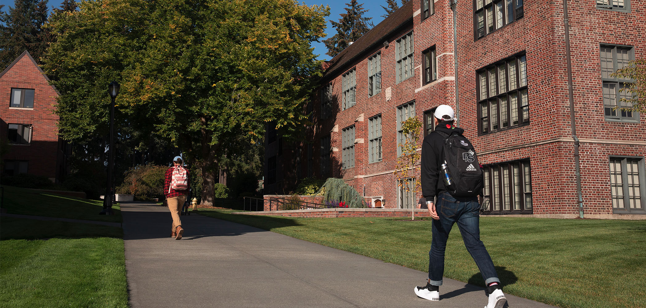 Students walking near Howarth Hall on campus