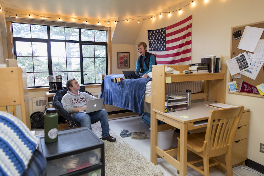 Two students in a residence hall room