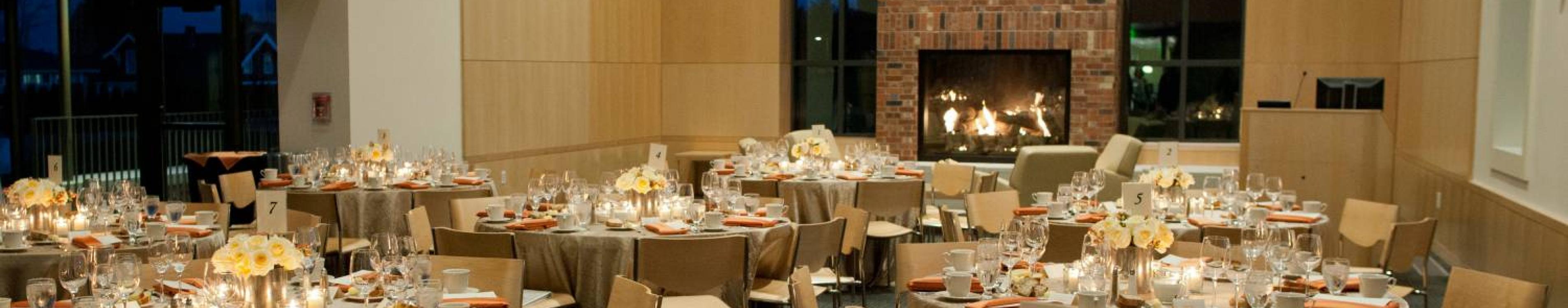 The Tahoma room set up with formal table settings for an event