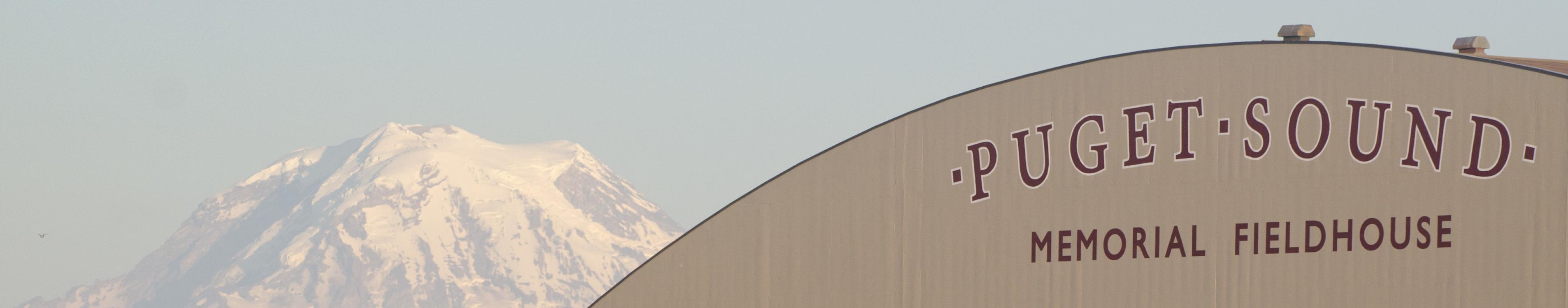 Exterior view of Memorial Fieldhouse with Mt. Rainier in the background. 