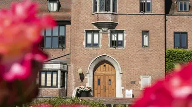 Brick building with flowers in front