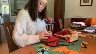 A woman working with sewing materials