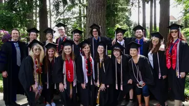 Graduate students wearing caps and gowns