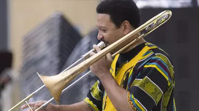 Jazz legend Delfeayo Marsalis plays trombone during rehearsal with the Puget Sound Jazz Orchestra