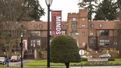 Jones Hall with Curious Minds lamp post banner in forefront