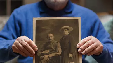 Henry Haas ’60 holding an image of his grandparents