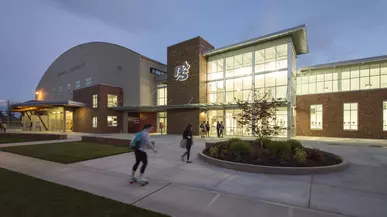 Athletics and Aquatics Center at night.