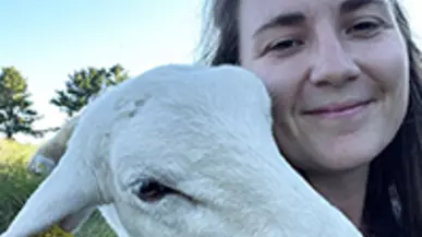 Anna Houston '12 and a wooly friend