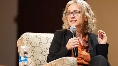 Prof. Robin Jacobson moderates a discussion on campus with members of the Washington State Supreme Court in 2023.