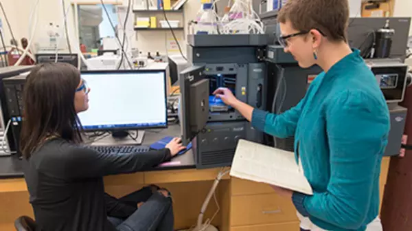 Students working with the mass spectrometer.