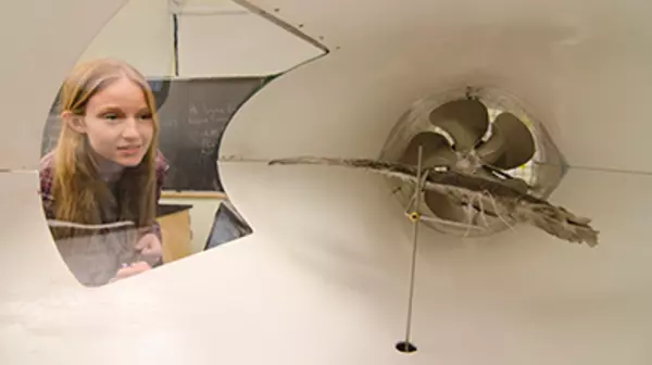 Student using a wind machine for research.