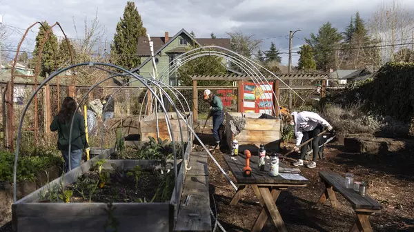 Garden Club members working in the campus garden