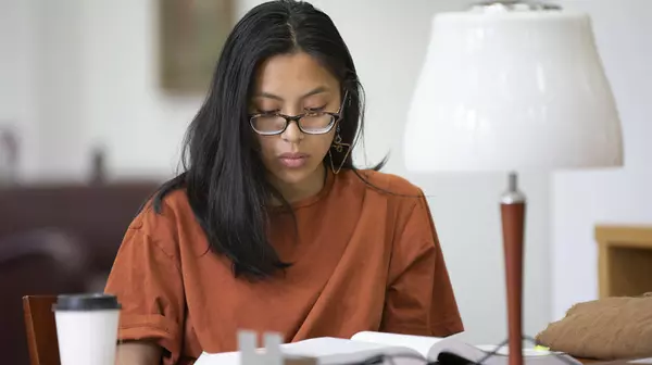 Student studies in the library