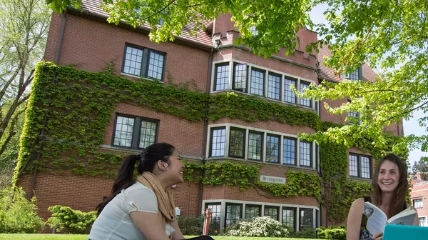 Students seated outside McIntyre Hall