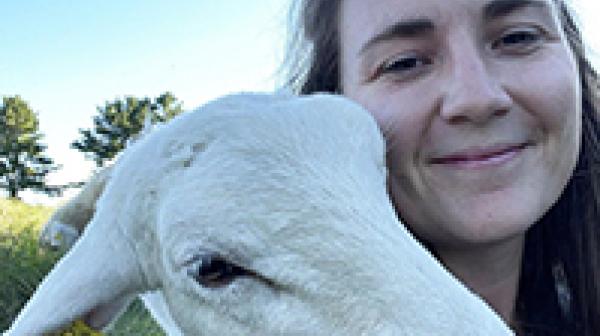 Anna Houston ’12 and a wooly friend