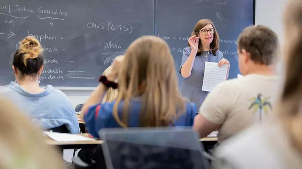 A professor engaged with their class