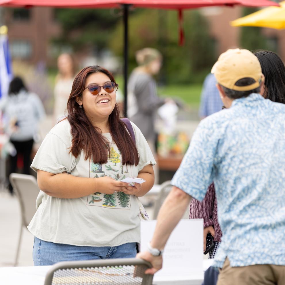 Students chat on the plaza outside Wheelock Student Center.