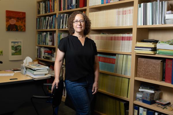 Professor Stacey Weiss, associate chair of biology and William L. McCormick Professor of Natural Sciences, stands in her office.