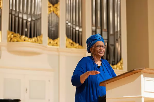 A guest lecturer presents to a crowd in Kilworth Memorial Chapel.