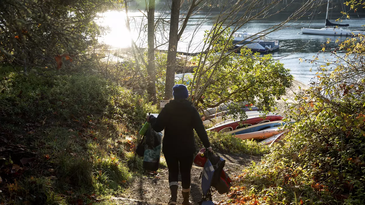 Kelly Danielson M.O.T.’12 makes her way down to the beach where the family's boat is moored.