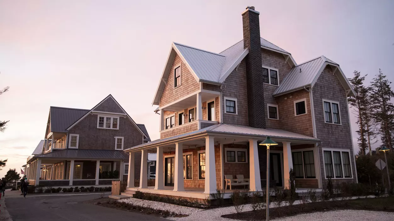 A large house facing toward the sunset