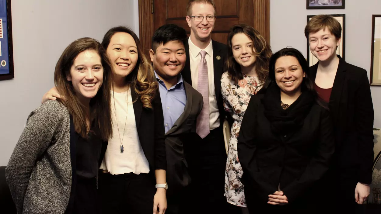 A group of people in formal attire