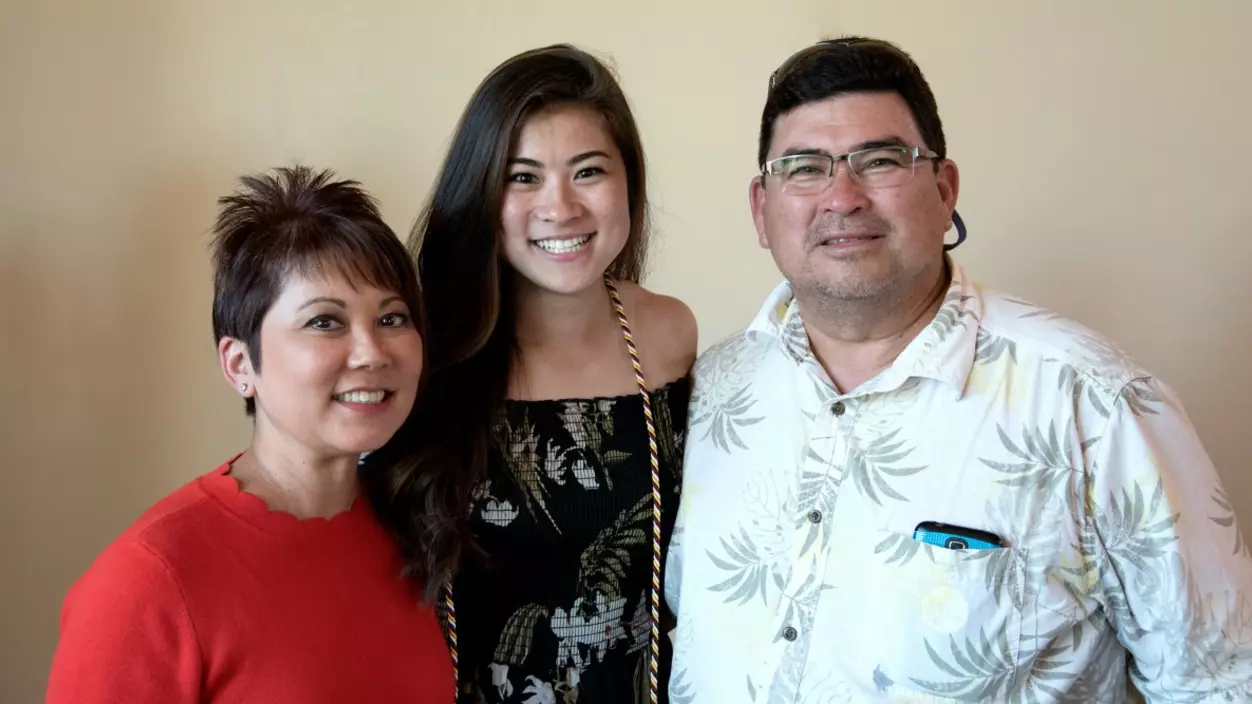 Three people smiling