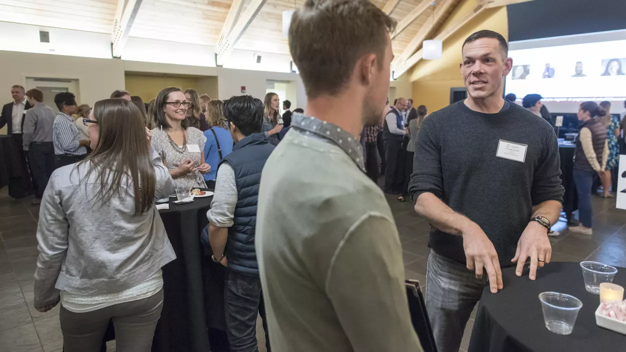 People talking at a networking event