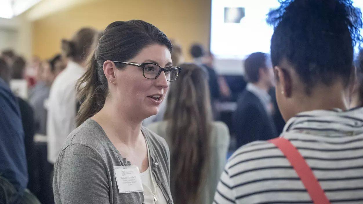 People talking at a networking event