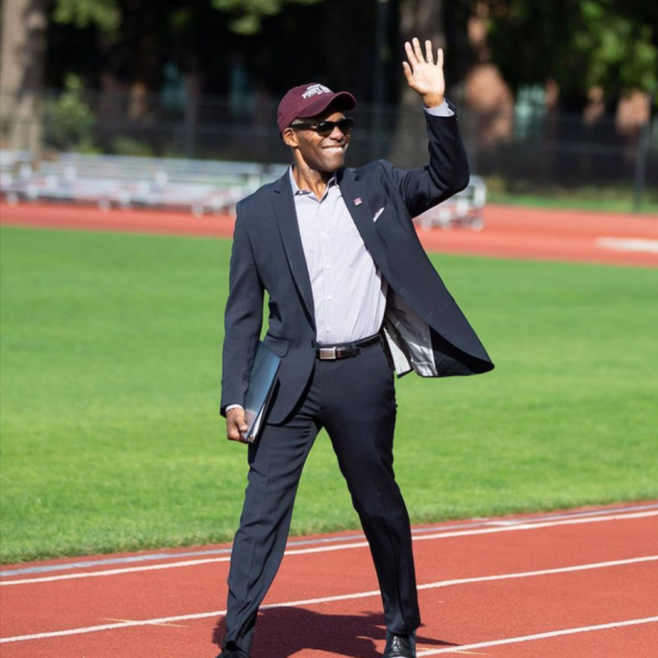 President Crawford waves on his way to greet the crowd in Baker Stadium during Summer Reunion Weekend.
