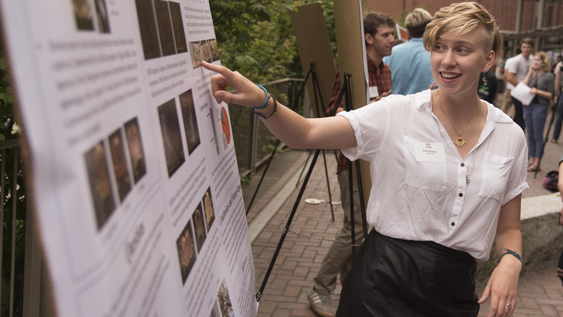 Elise Phillips '18 presents her summer research at the Fall Undergraduate Research Symposium.