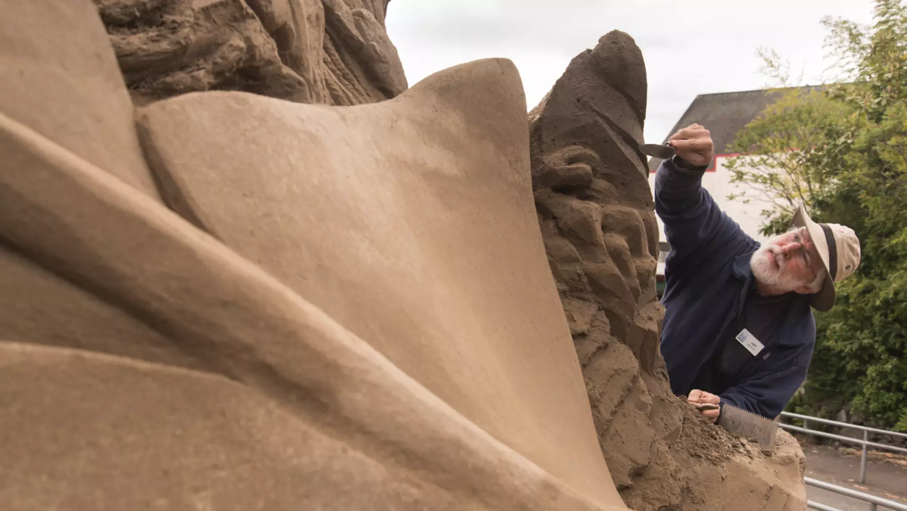 Jeff Strong working on a sand sculpture