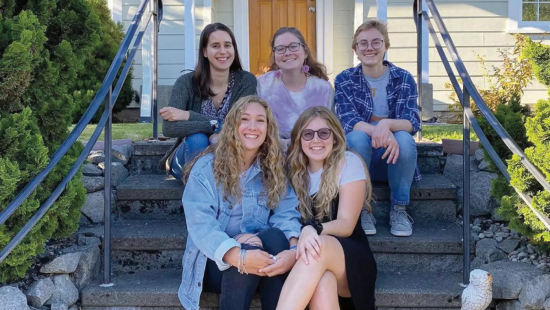 girls in front of house