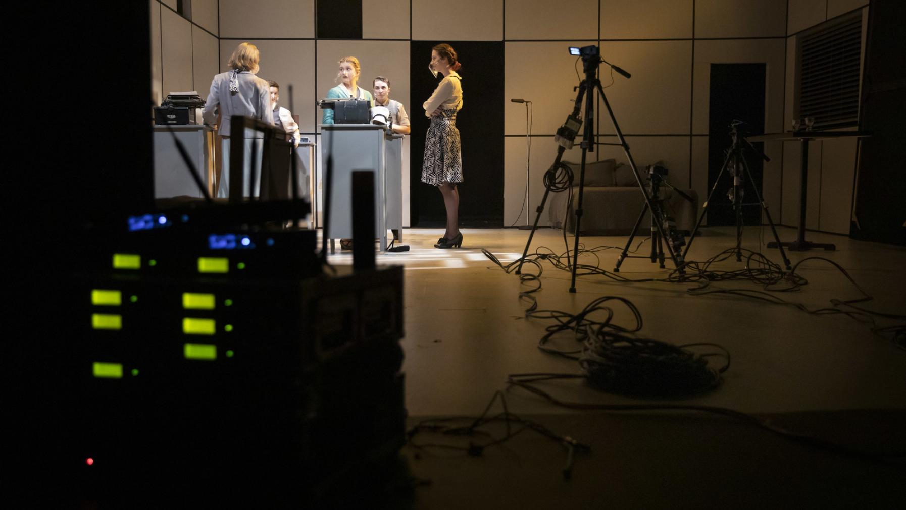 Students perform onstage in Norton Clapp Theatre with streaming equipment visible