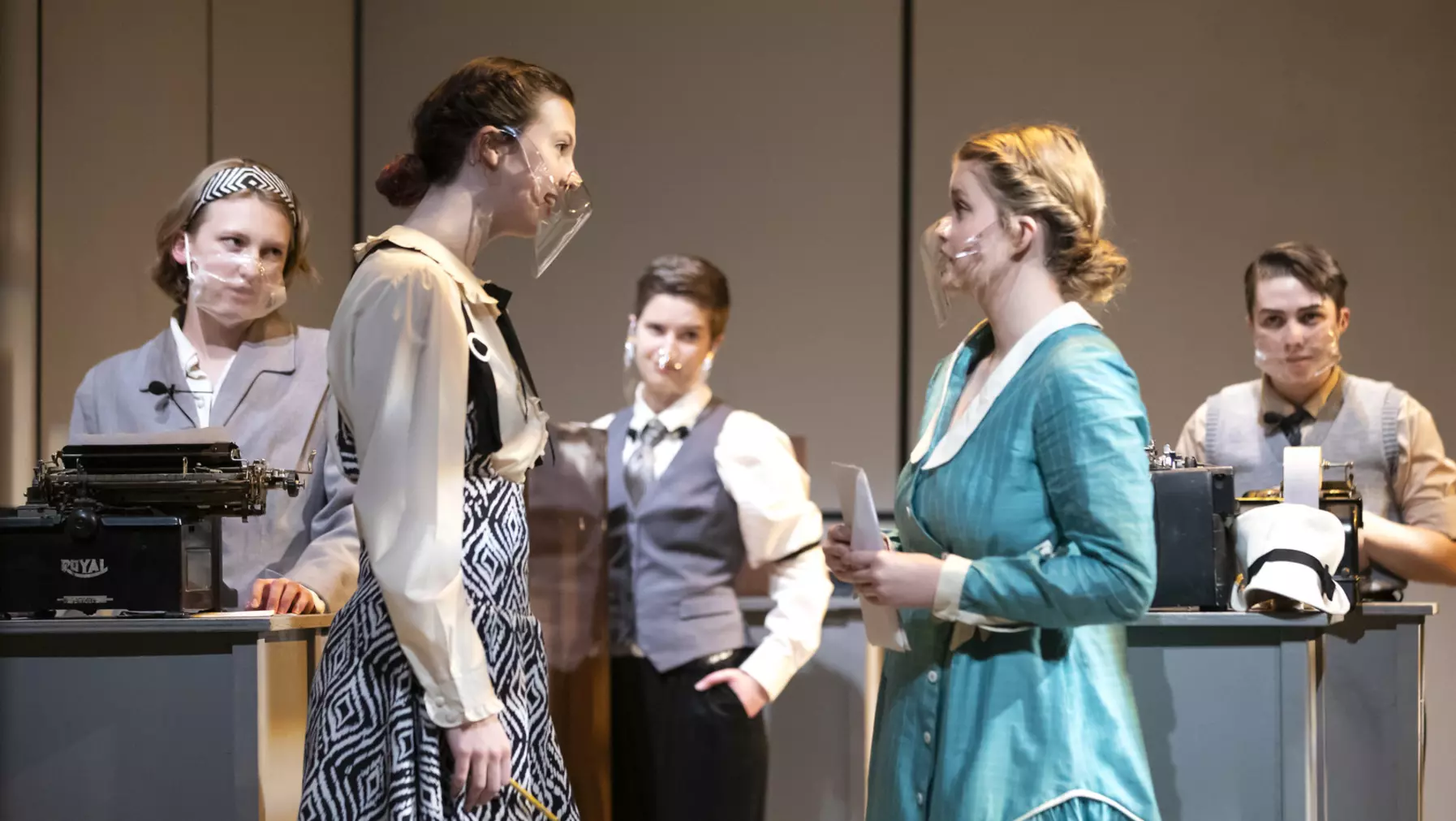 A group of students onstage in Norton Clapp Theatre during a performance of Machinal