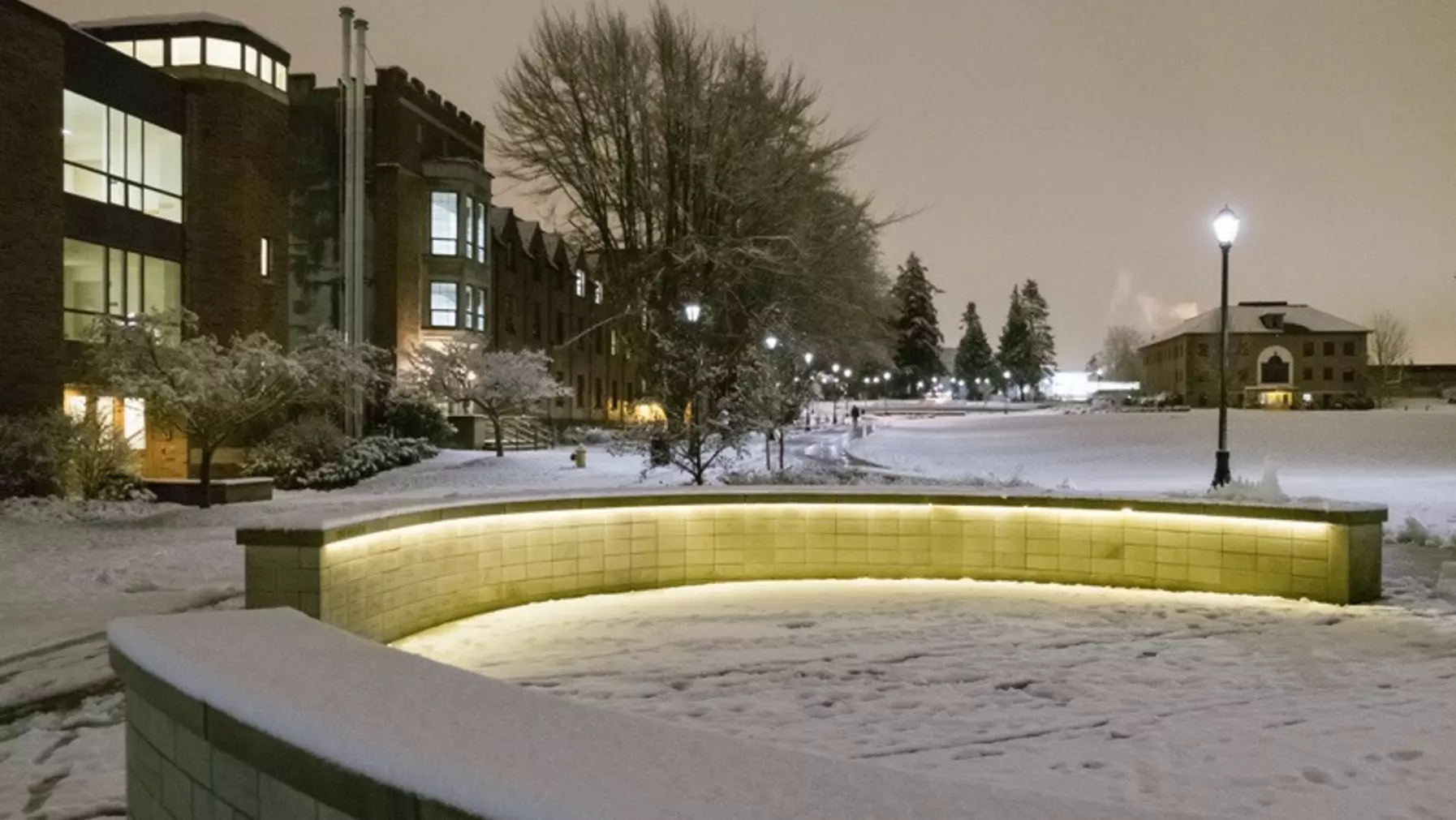 Benefactor Plaza at dusk covered with a dusting of snow