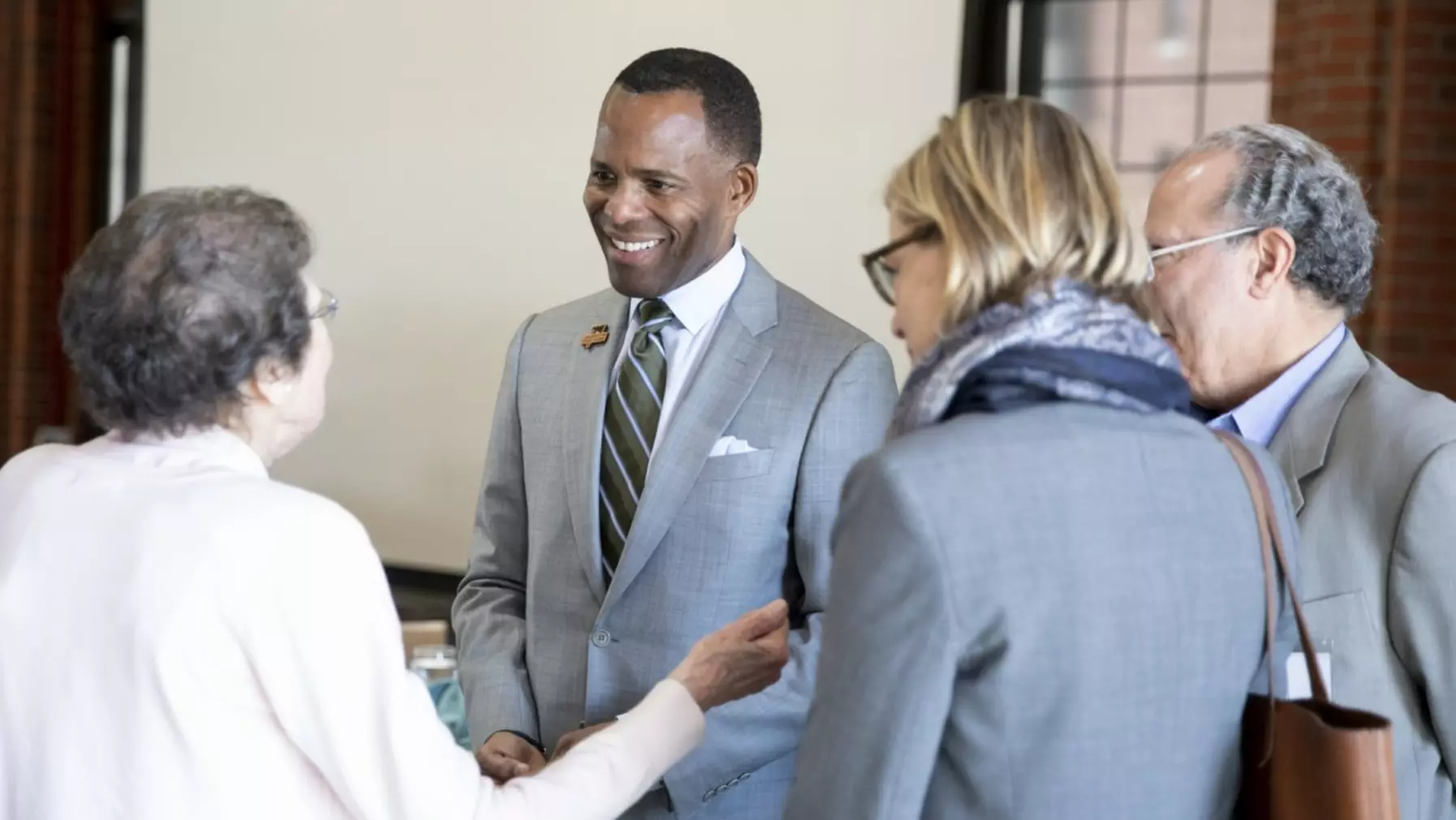 President Crawford talking to a group of people