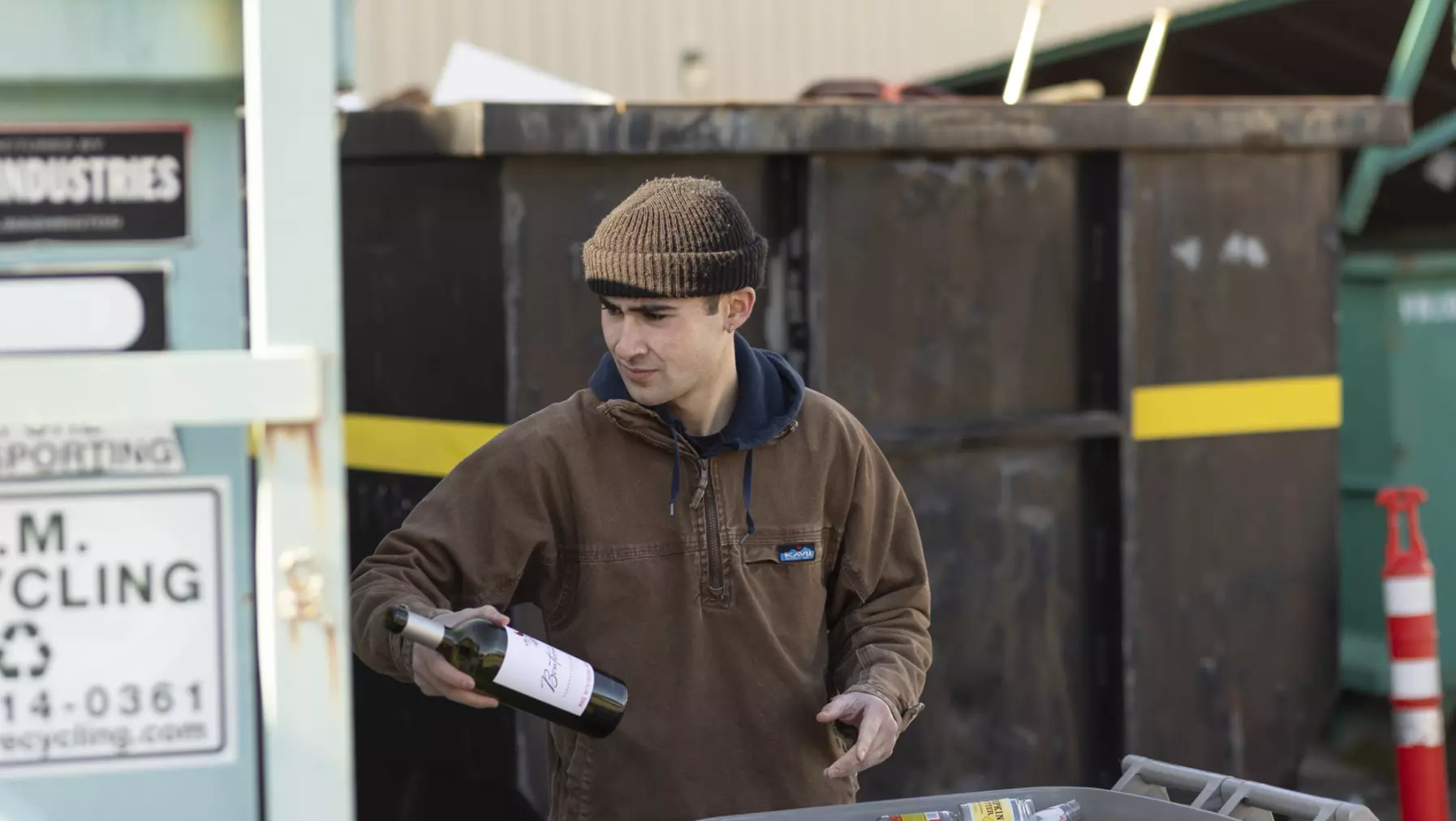 Alden Robert ’23 separates glass recycling on campus