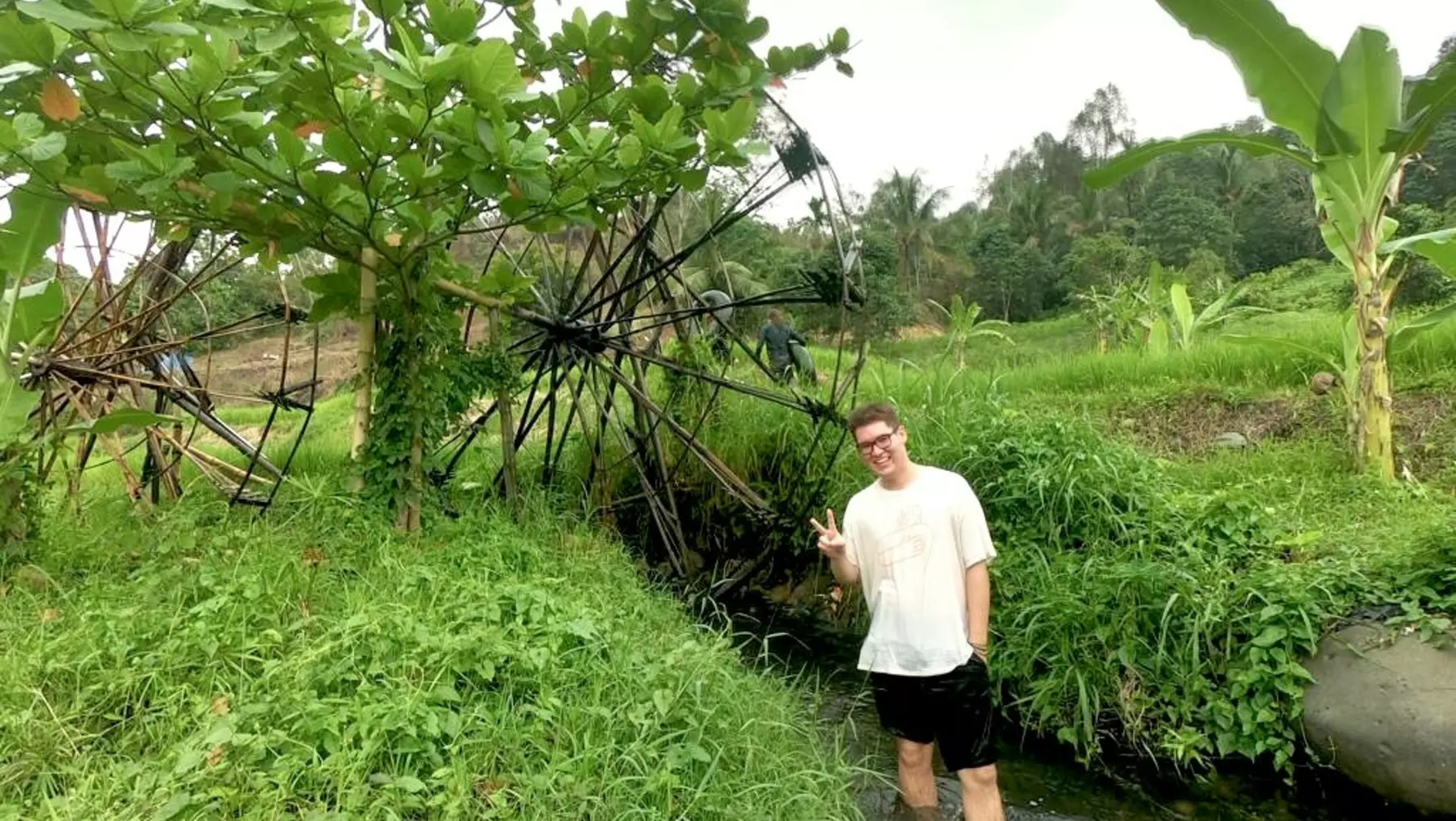 Nicholas Navin standing in a creek