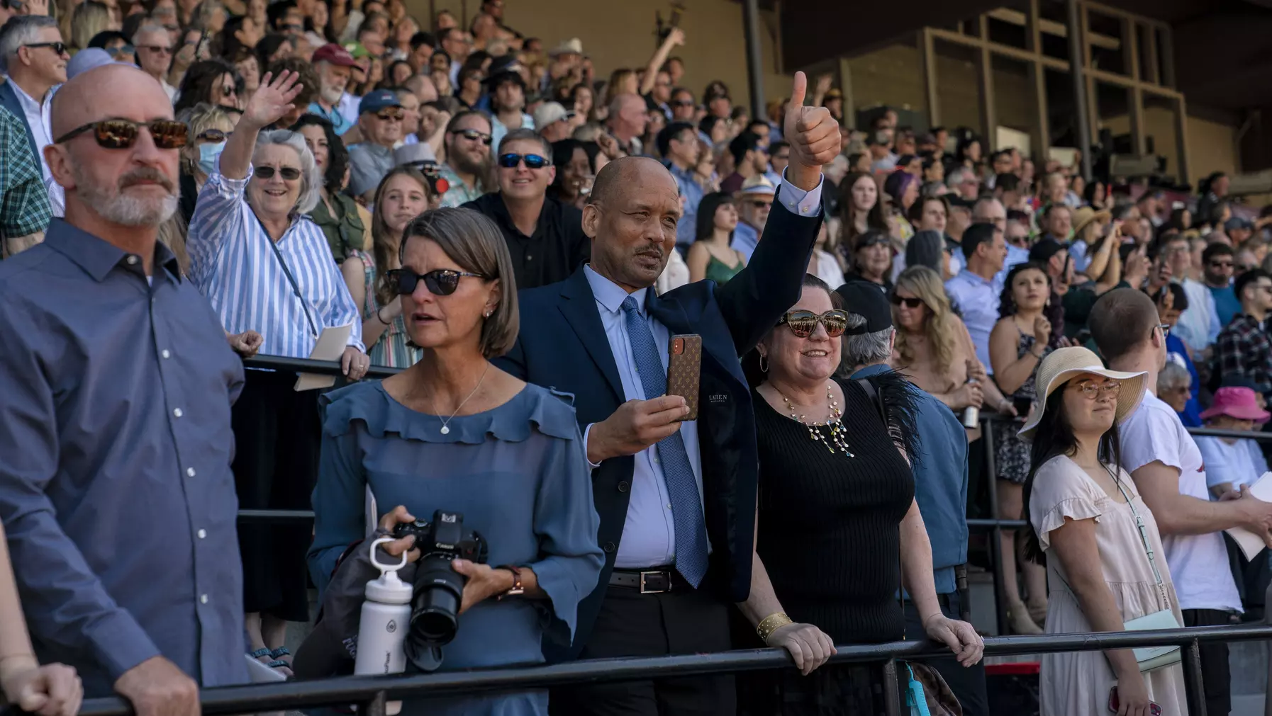 Family and friends celebrate graduates.